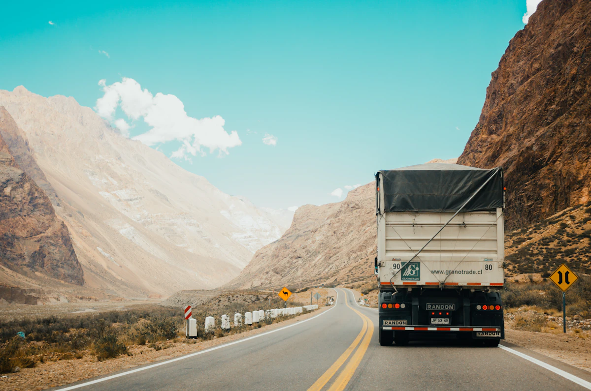 A truck travelling on a mountain road.